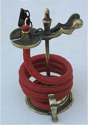 Metalware<br>Archives<br>An 18th century Brass Waxjack