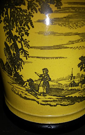 Yellow-glazed mug with black transfer