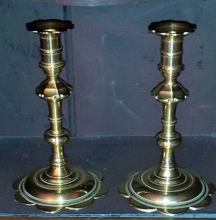 Metalware<br>Archives<br>A pair of Queen Anne petal base candlesticks