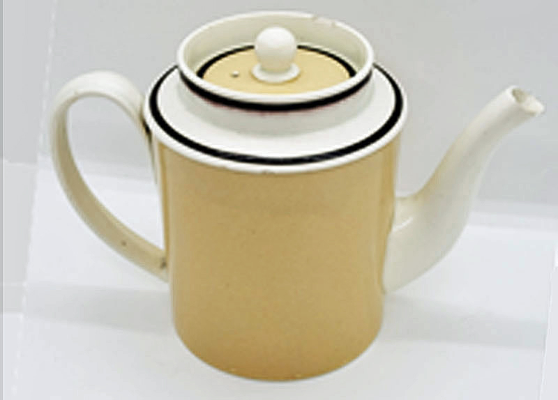 Creamware teapot with slip decoration