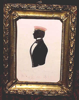 SOLD   Silhouette of a young man in a red cap.