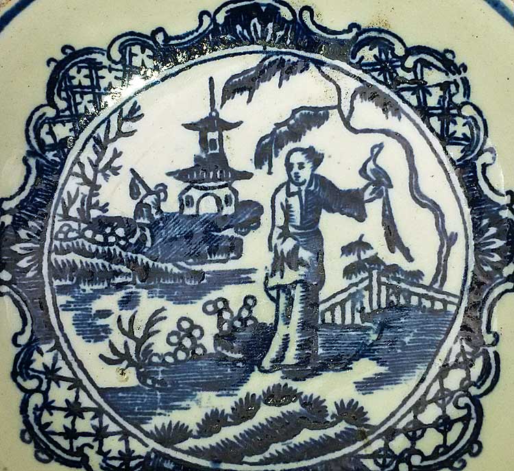 Early porcelain saucer with Chinoiserie transfer print.