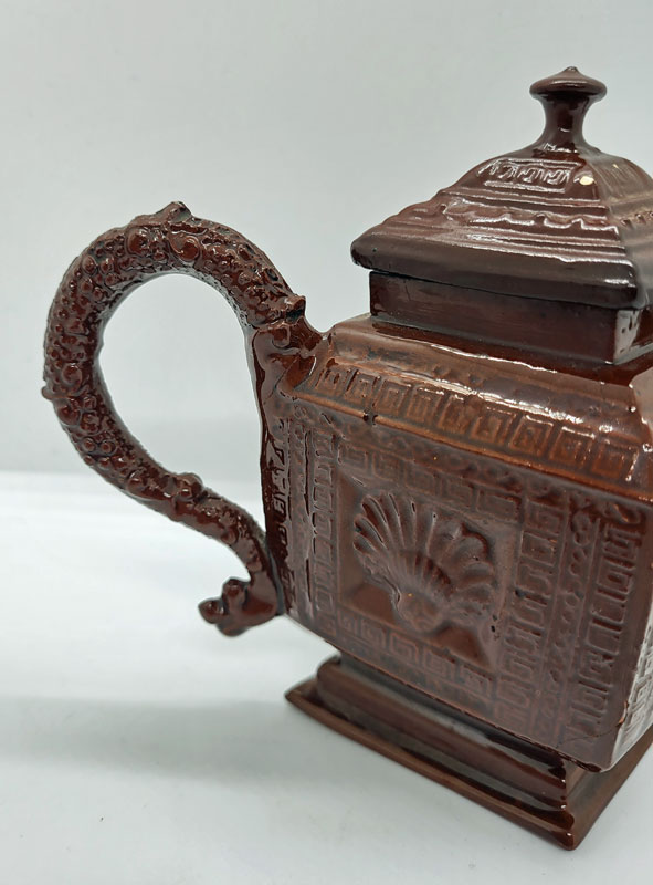 A Red Stoneware Lozenge Shaped Teapot