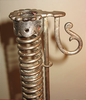 Metalware<br>Archives<br>PAIR OF IRON PIGTAIL CANDLESTICKS