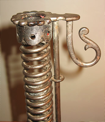 PAIR OF IRON PIGTAIL CANDLESTICKS