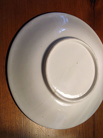 Porcelain Saucer with bottle oven transfer