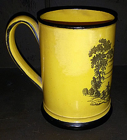 Yellow-glazed mug with black transfer