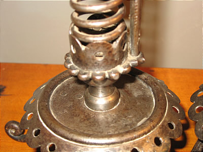 PAIR OF IRON PIGTAIL CANDLESTICKS
