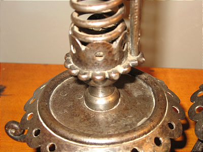 Metalware<br>Archives<br>PAIR OF IRON PIGTAIL CANDLESTICKS