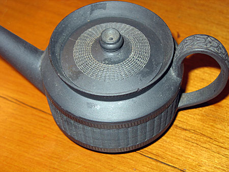 SOLD  One cup, or toy sized, engine turned basalt teapot