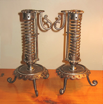 PAIR OF IRON PIGTAIL CANDLESTICKS