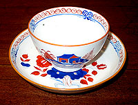 SOLD  A Lowestoft Soft Paste tea bowl and saucer.
