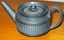 SOLD  One cup, or toy sized, engine turned basalt teapot