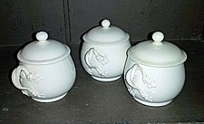 Three Creamware covered custard cups