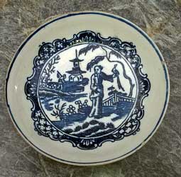 Early porcelain saucer with Chinoiserie transfer print.