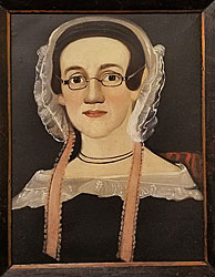 Portrait of a lady wearing glasses.