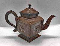 A Red Stoneware Lozenge Shaped Teapot