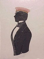 SOLD   Silhouette of a young man in a red cap.